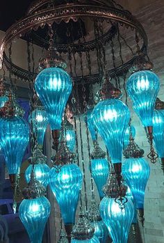 a chandelier with many blue glass balls hanging from it