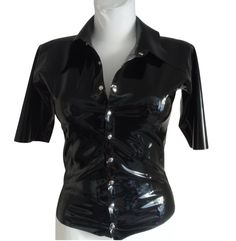 Latex blouse with a collar, fastened with snaps at the front. This item is made to order. After placing the order, please provide the dimensions in the comments: bust, waist, hips and arm circumference. If you have any questions, please contact us. - Made in Poland - Latex made in Poland - Handmade product. LATEX CARE: - Be careful with sharp objects, including jewelry or fingernails. - Do not use oil-based lubricants, including body moisturizers. - After use, wash in mild soapy water and then rinse with fresh water. Hang up and leave to dry in a dry place. - When dressing, talcum the product well or use silicone-based lubricants. - Store at room temperature and do not expose to sunlight or UV lamps. The company does not accept returns of custom-made products. If for some reason the item d Fitted Short Sleeve Tops With Button Closure, Short Sleeve Party Tops With Buttons, Fitted Tops With Button Closure And Collared Neckline, Fitted Short Sleeve Shirt For Night Out, Classic Fitted Padded Blouse, Fitted Collared Shirt For Party, Stretch Button-up Party Blouse, Stretch Short Sleeve Blouse With Buttons, Short Sleeve Stretch Blouse With Buttons