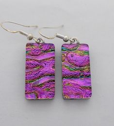 I fused 2 layers of glass to create this gorgeous earring ,,dichroic glass and clear glass on the top. The size is 1/2" by 1 " .All my jewelry come in a nice gift box. Handmade Iridescent Czech Glass Earrings, Iridescent Nickel-free Earrings As A Gift, Purple Czech Glass Earrings For Gift, Clear Glass Earrings As A Gift, Clear Glass Earrings For Gifts, Clear Glass Earrings For Gift, Iridescent Czech Glass Drop Earrings, Iridescent Czech Glass Earrings For Gift, Nickel-free Rectangular Czech Glass Jewelry