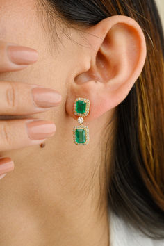 3.77 Carat Real Emerald and Halo Diamond Dangle Earrings in 18K Gold will make a statement about your style. You'll need dangling earrings to make a statement with your attire. These earrings, made of octagon cut emeralds and round cut diamonds, give a glittering, sumptuous appeal.
Emerald boosts a person's intellectual capacity.
Designed with an octagon cut emerald and a halo of diamonds dangling down the emerald, as well as a diamond halo stud joined with a diamond in the center of solid gold. Luxury Green Diamond Halo Earrings, Gia Certified Formal Drop Earrings, Gia Certified Diamond Drop Earrings, Elegant Gia Certified Drop Earrings, Gia Certified Dangle Earrings For Formal Events, Gia Certified Dangle Earrings For Formal Occasions, Gia Certified Dangle Earrings, Earrings To Make, Halo Diamond Earrings