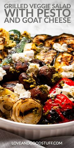 grilled veggies salad with pesto and goat cheese in a white bowl