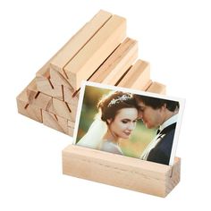 a wooden block with a photo on it and some wood blocks in front of it