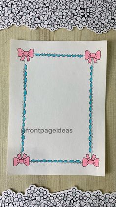 a piece of paper with pink bows on it