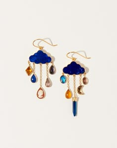 Grainne Morton Cloud and Rain Drops Earrings in Lapis. Playful cloud earrings made with made with lapis, cameo, abalone, fine opal, mystic coated quartz, amethyst, and vintage rhinestone, set in 18k gold plated silver. Hook ear fitting. Handmade in Edinburgh, Scotland. Dimensions: 2.36" long, 1" wide Material: 18K gold plated silver Origin: Scotland Why we Covet: Cult of smallness. Manta Ray Earrings, Hand Made Earings, Fun Earrings Unique, Eccentric Earrings, Handmade Earrings Ideas, Eclectic Earrings, Mystical Outfits, Interesting Earrings, Grainne Morton