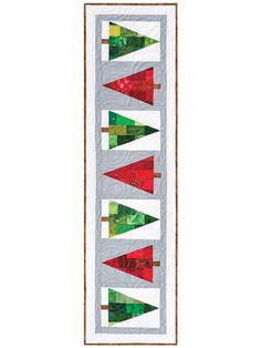 a quilted banner with christmas trees on it