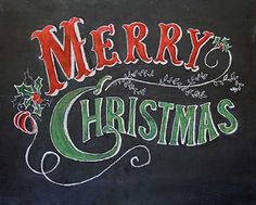 a chalkboard sign with the words merry christmas written in red and green on it