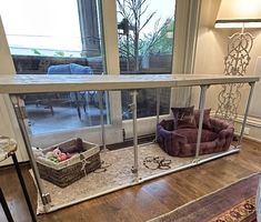 a dog house with two dogs in it's kennel and one is on the floor