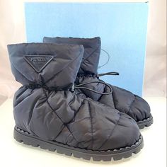 Nwt$1,120 Prada Blow 19 Quilted Nylon Drawstring Winter Snow Bootie Boot Sz 39.5 Prada's Blow 19 Puff-Quilted Boots Are Crafted Of Nylon And Complete With A Drawstring Closure. Recycled Polyamide Upper Round Toe Pull On With Drawstring Recycled Polyamide Lining Rubber Sole Made In Italy Size Heel Height, About 0.75" (19mm) Shaft Height About 9.5" Brand New From Saks Fifth Avenue!! Strikeout To Prevent Returns Back To Saks. 100% Authentic With Original Box!! Tags: Fall, Autumn, Halloween, Winter, Luxury Winter Boots For Outdoor, Luxury Winter Outdoor Boots, Nylon Boots With Round Toe For Fall, Fall Nylon Boots With Round Toe, Designer Waterproof Boots With Round Toe, Designer Winter Boots With Lug Sole, Designer High-top Winter Boots, Black Nylon Boots With Padded Ankle, Winter Nylon Boots With Round Toe