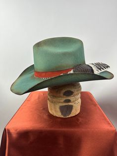 *PRICE INCLUDES $15 HAT BOX* Premium Wool Felt  4 1/4 Crown, 3 3/4 inch brim Custom Color, Distressing, Band and Accessories Colors may vary slightly. Although each hat is unique a similar hat can be made in various sizes.  Size Chart Small - 6 7/8  Medium - 7 1/8 Large - 7 3/8 XL - 7 5/8 XXL- 7 3/4 All Sales Final Adjustable Fur Felt Hat For Kentucky Derby, Custom Flat Brim Felt Hat For Western-themed Events, Custom Fur Felt Brimmed Hat Bands, Green Hat Bands For Rodeo With Short Brim, Green Short Brim Hat Bands For Rodeo, Custom Flat Brim Fedora For Western-themed Events, Green Wide Brim Western Hat, Custom Handmade Top Hat For Country Events, Green Western Hat Bands For Kentucky Derby