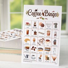 a coffee bingo game sitting on top of a table next to a stack of books