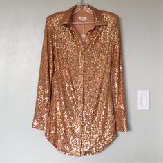 Camila Coelho Erika Gold Sequin Long Sleeve Shirt Dress - New With Tags - Revolve Style No. Coel-Wd307 - Size: Xs In Gold - Self: 95% Polyester, 5% Spandex - Lining: 100% Polyester - Hand Wash - Fully Lined - Front Button Closure - Padded Shoulders - Buttoned Cuffs - Sequined Embellishments Throughout - Approx. Measurements: 16" Pit To Pit, 14.25" Waist, 16" Hip, 14.5" Shoulder, Shoulder 25", 31.5" Length (Center - Hem) Gold Long Sleeve Mini Dress For Fall, Fitted V-neck Shirt Dress For Party, Fitted Long Sleeve Shirt Dress For Evening, Fitted Shirt Dress For Fall Party, Long Sleeve Dress For Dress Down Party Season, Fitted Shirt Dress For Evening In Fall, Chic Fitted Shirt Dress For Party, Fall Long Sleeve Shirt Dress For Party, Fall Cocktail Long Sleeve Blouse