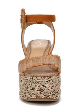 An earthy embroidered jute platform and heel lift this chunky ankle-strap sandal fastened with a circular faux-raffia-adorned buckle. 4 1/4" heel; 2" platform Adjustable ankle strap with buckle closure Synthetic and textile upper/synthetic lining and sole Imported Fabric Platform Sandals With Ankle Strap, Platform Espadrilles With Ankle Strap, Spring High Heel Espadrille Heels, Espadrille High Heels For Spring, Beige Fabric Open Toe Sandals, Fabric Open Toe Wedge Sandals With Platform, Summer Fabric Sandals With Wrapped Heel, Summer Fabric Heels With Heel Strap, Platform Espadrille High Heel Sandals