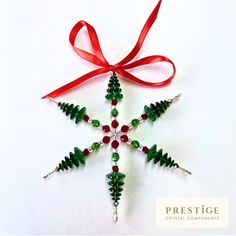 a christmas ornament made out of beads and ribbon