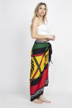 Description: Embrace your free spirit with this multi way Rasta Star Lions Sarong. This is the fashion accessory that can be used in 50 different ways. Wear it as a dress or skirt during the summer, then use it as a shawl or scarf during the winter. It can even serve as a beach towel for soaking up sun or as a throw for relaxing at home. The fabric is soft and light, keeping you comfortable no matter how you wear it. Pair with our other rasta items for a complete look. Details: Construction: 100 Bohemian Beach Scarf, Casual Summer Festival Scarves, Multicolor Bohemian Sarong For Festivals, Bohemian Multicolor Sarong For Festivals, Multicolor Bohemian Wrap Sarong, Bohemian Multicolor Wrap Sarong, One Size Summer Festival Scarves, Summer Festival Scarf, Black Bohemian Scarf For Summer