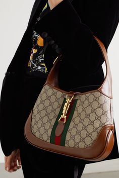 Beige Jackie 1961 small webbing-trimmed coated-canvas and leather shoulder bag | GUCCI | NET-A-PORTER Gucci Handbag, Counter Decor, Bathroom Counter, Latest Bags, Dior Handbags, Gucci Fashion, Bags Aesthetic, Gucci Handbags, Small Shoulder Bag