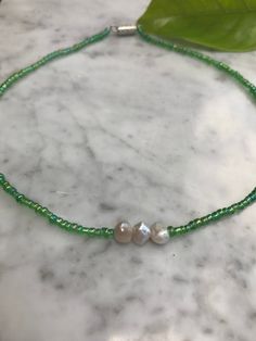 This necklace was handmade by me. It was inspired by earth day, with the green beads around the choker. Adjustable Handmade Green Pearl Necklace, Adjustable Green Pearl Necklace, Green Pearl Jewelry With Tiny Beads, Bead Choker, Green Beads, Pompano Beach, Choker Necklaces, Beaded Choker, Green Bead