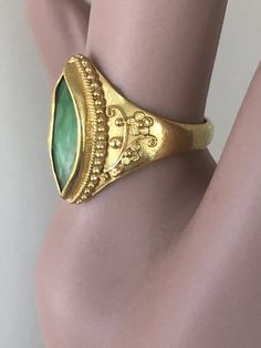 "Antique Chinese Qing Dynasty 22k Gold Navette JADEITE Ring size 6 Hand Crafted 5 grams The Navette Shaped Jadeite Measures: approximately 5 X 14mm The Jadeite is Hand Set in a sculptural Setting Hallmarked on the inside with a Chinese stamp The Qing dynasty , officially the Great Qing, also called the Empire of the Great Qing or the Manchu dynasty, was the last imperial dynasty of China, ruling from 1644 to 1912 with a brief, abortive restoration in 1917. It was preceded by the Ming dynasty and Luxury Gold Emerald Collectible Ring, Luxury Gold Emerald Ring Collectible, Gold Engraved Emerald Ring For Formal Occasions, Traditional Gold Emerald Anniversary Ring, Antique Gold Emerald Cabochon Ring, Collectible Yellow Gold Emerald Cabochon Ring, Collectible Yellow Gold Emerald Ring With Cabochon, Elegant 22k Gold Emerald Ring, Heirloom Gold Emerald Cabochon Ring