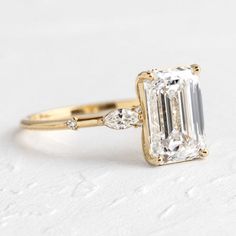 Windlass Ring, Emerald Cut Diamond | Melanie Casey Fine Jewelry Timeless Rectangular Prong Set Emerald Ring, Timeless Rectangular Emerald Ring With Prong Setting, Timeless Rectangular Brilliant Cut Emerald Ring, Timeless Emerald Ring With Radiant Diamond Cut, Timeless 14k Gold Radiant Cut Rings, Timeless Radiant Cut Emerald Ring, Yellow Gold Square Cut Emerald Diamond Ring, Timeless Rectangular Diamond Ring, Square Cut Emerald Ring In Yellow Gold With Diamonds