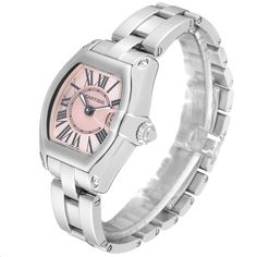 Cartier Roadster Small Pink Dial Steel Ladies Watch W62017V3. Swiss quartz movement calibre 688. Stainless steel tonneau shaped case 36 x 30 mm. . Scratch resistant sapphire crystal with cyclops magnifier. Pink sunray effect dial with black Roman numerals. Luminescent sword shaped steel hands. Date window at 3 o'clock. Stainless steel bracelet with hidden butterfly clasp, fits 6 1/4" wrist. Cartier Roadster, High End Watches, Luxury Timepieces, Vintage Rolex, 3 O Clock, Magnifying Glass, Beautiful Watches, Ladies Watch, Rolex Datejust