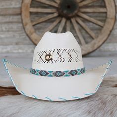 The Charlie 1 Horse Apache Jr. Children's Straw Cowgirl Hat is a delightful fusion of playful colors, charming patterns, and classic cowboy style. This vibrant hat features a multicolored patterned beaded hatband, a 4 1/8" cattleman crown for a stylish silhouette, and a 4" brim adorned with turquoise whip-stitched edges for a touch of elegance. Designed for young cowgirls who embody the spirit of adventure and joy.Fits up to 55.5 cm 4"Brim 4 1/8"Crown Color: White Staw Western Blue Hat Bands For Ranch, Western Blue Hat Bands For Country Events, Blue Hat Bands For Rodeo In Summer, Blue Country Hat Bands For Western-themed Events, Blue Country Style Hat Band For Western-themed Events, Blue Country Style Hat Bands For Western-themed Events, Blue Country Style Hat Bands For Western Events, Blue Western Hat For Rodeo, Western Blue Hat Bands For Beach