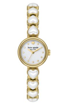 Add an elegant touch to any outfit with this chic round watch featuring a mother-of-pearl dial and a slim bracelet adorned with heart-shaped imitation pearls. 24mm case; 10mm band width Deployant clasp closure Three-hand quartz movement Mother-of-pearl dial Mineral crystal face Stainless steel with goldtone plate/imitation pearl Imported Kate Spade Watch, The Bling Ring, Dope Jewelry