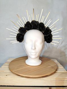 Elevate your look with the Gold Halo Crown with Black Roses, a breathtaking blend of elegance and darkness, perfect for Gothic weddings, festivals, Halloween, or any dramatic event. This handmade-to-order crown features bold black roses set against a stunning gold halo, creating a captivating and ethereal aesthetic. The crown's spikes radiate from a sturdy metal headband, forming a celestial silhouette that adds a touch of divinity to your gothic style. Each limited-edition piece is meticulously Black Fantasy Headpieces For Alternative Fashion, Gothic Headpiece, Black Fantasy Headpiece With Tall Crown, Luxury Gothic Headpieces For Festivals, Gothic Structured Crown For Festivals, Gothic Halo Crown, Bachelorette Crown, Black Flower Crown, Halloween Crown