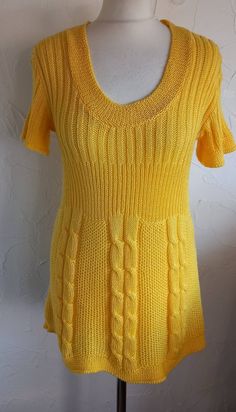 "Great condition knit top from the 90s  Made in Italy Label faded but possibly viscose acylic in yellow yarn Short sleeved  Deep round neckline  Short sleeved 5\" deep rib waist  Cable design under waist Measurements in inches ( Taken relaxed) Back neck width 9.5\" Across shoulder point to point 18.5\" Armhole circ 16\" Sleeve length 6\" Sleeve opening 14\" Chest 34\" Waist 31\" Hem 48\" Length from side neck point to hem 28\" To see more vintage follow www.etsy.com/shop/skinnyrib" Fitted Yellow Knit Sweater, Yellow Fitted Knit Sweater, Fitted Yellow Crew Neck Sweater, Fitted Yellow Knitted Sweater, Fitted Yellow Knit Top, Ribbed Yellow Knit Top, Yellow Fitted Knit Top For Fall, Fitted Yellow Casual Sweater, Yellow Ribbed Knit Top