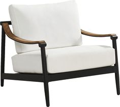 a white chair with black frame and wood arm rests on a white cushioned surface