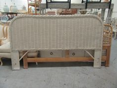 a wicker headboard with two drawers on each side