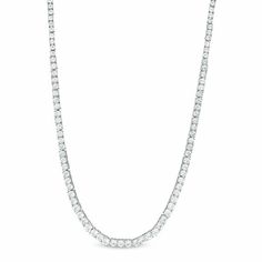 A chic classic, this stunning tennis necklace is certain to be worn often. Crafted in sterling silver, this timeless design showcases a luxurious length of graduated-size lab-created shimmering white sapphires - the largest stones being 4.0mm. Buffed to a brilliant luster, this 17.0-inch necklace secures with a box clasp. Classic Diamond White Tennis Necklace With Prong Setting, Classic Tennis Necklace In Diamond White Cubic Zirconia, Classic Tennis Necklace In Diamond White With Brilliant Cut, Timeless White Tennis Necklace With Prong Setting, Classic Tennis Necklace In White Gold With Brilliant Cut, Classic Lab Grown Diamond Tennis Necklace For Anniversary, Classic Diamond Cut Tennis Necklace In Diamond White, Classic Tennis Necklace With Lab Grown Diamonds For Anniversary, Classic Diamond White Tennis Necklace With Brilliant Cut