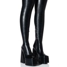 Make Your Move In The Azalea Wang " The Ultimate Strut Stretch "This Way Thigh High Platform Boot In Black. This Thigh High Boot Features An Ultra-Chunky Heel, A Platform Base, A Slightly Squared Toe, A Faux Leather Upper, And A Tonal Inner Ankle Zipper Closure. - Faux Leather Upper - Slightly Squared Toe - Chunky Heel - 25” Shaft Height - 14" Calf Circumference (With Additional Stretch From Material) - 5.5” Heel Height - 2” Platform Height Leather Boots Reference, Y2k Platform Boots, Azalea Wang Shoes, Fitted Knee-high Platform Boots For Club, Fitted Thigh High Platform Boots, Fitted Platform Heeled Boots For Club, Fitted High Cut Heeled Boots For Night Out, Fitted High-cut Heeled Boots For Night Out, Fitted Knee-high Platform Heeled Boots