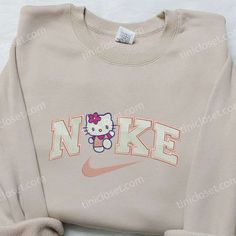 The Hello Kitty And Line x Nike Embroidered Shirt is a delightful collaboration between two iconic brands. Made with premium Cheap Cute Hello Kitty Sweatshirt, Cheap Hello Kitty Print Cute Sweatshirt, Hello Kitty Head Oversized Shirt, Maroon Hoodie, Custom Nike, Hoodie Material, Custom Nikes, Unique Shirt, Nike Sweatshirts