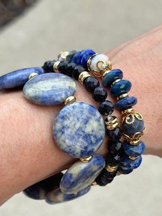 *7in. Genuine Blue Lapis Lazuli and Sodalite *18kt. gold filled beads *18kt. gold plated accent beads *Coin genuine Sodalite *Blue goodnight  * quality stretch cord for a comfortable fit *Made in 7in length.  Message our shop if you need a bigger size and we would be glad to do that for you. Sizing  Measure your wrist with a string and measure the string with a ruler or measuring tape.  Be sure to add an inch or two foe desired fit. Blue Lapis Lazuli Gemstone Beaded Bracelet, Bohemian Blue Rondelle Bracelets, Blue Spiritual Stackable Jewelry, Bohemian Blue Rondelle Beaded Bracelets, Blue Spiritual Stackable Beaded Bracelets, Blue Gemstone Stretch Bracelet As Gift, Adjustable Blue Gemstone Stretch Bracelet, Blue Sodalite Gemstone Beaded Bracelets, Healing Blue Stackable Bracelets