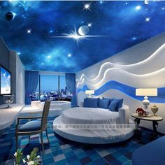 the bedroom is decorated in blue and white with stars on the ceiling, as well as a round bed