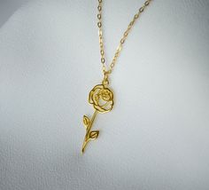 This beautiful gold or silver June Rose birth flower necklace would be a perfect gift for a Mom, Grandma, Aunt, bridesmaid, friend, or any loved one. It's a perfect way to celebrate a family. The back of the pendant has the month and flower type engraved. You can add up to 4 birth flower pendants and birthstones. These are also available without a birthstone. It can be made with a gold or silver plated chain or a sterling silver, or 18k gold-filled chain and is available in 16, 18 or 20 inches ( Dainty Rose Flower Jewelry, Dainty Flower-shaped Rose Jewelry, Dainty Flower Shaped Rose Jewelry, Dainty Rose-colored Flower-shaped Jewelry, Rose Flower-shaped Jewelry For Mother's Day, Elegant Rose Gold Flower Necklace As Gift For Mom, Elegant Rose Gold Flower Necklace For Mom, Delicate Flower Shaped Jewelry With Rose Design, Delicate Flower-shaped Jewelry With Rose Design