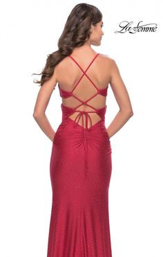 La Femme 31399 Rhinestone jersey dress with crisscross bodice and cut outs. Lace up strappy back with ruching along the zipper. Glamorous Backless Dress With Lace-up Back, Elastane Dress With Ruched Back For Gala, Gala Dresses With Strappy Back Opening, Elegant Cross Back Dress For Gala, Fitted Evening Dress With Cross Back, Elegant Cross-back Dress For Gala, Backless Dress With Ruched Back For Prom Season, Formal Dresses With Cross Back And Back Opening, Fitted Dressy Dress With Spaghetti Straps