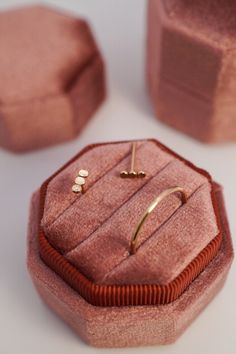 an open ring box sitting on top of a table