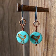 "This listing is for one pair of blue \"chick\" earrings with copper or hypoallergenic titanium ear wire (or color of your choice). These little Czech glass beads are so much fun. This listing is the first in several new earrings in my copper line. In keeping with my hypoallergenic items, I also have it available in titanium also. The titanium ear wires will be colored to match the bead when possible or it will be bronze colored. If you have not discovered titanium yet, and you struggle with you Blue Pierced Copper Earrings, Blue Copper Pierced Earrings, Nickel-free Bird-shaped Earrings For Gifts, Nickel Free Copper Dangle Earrings, Nickel Free Copper Drop Earrings, Nickel-free Copper Dangle Earrings, Bird-shaped Jewelry Set With Matching Earrings, Hypoallergenic Copper Dangle Earrings, Unique Hypoallergenic Copper Earrings