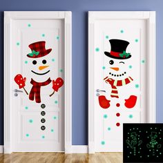 two snowmen with hats and scarfs are painted on the doors