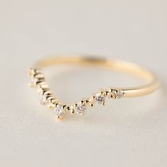 "The curve dips for 4.5mm and 9mm wide. This ring will match best with 7x5mm or 6x4mm oval stone ring. * Bandwidth: 1.5mm * Diamond detail: 0.084ctw G color SI quality * Material: Solid 14k/18k yellow gold, rose gold, white gold * 100% recycled gold and ethically sourced genuine diamond * Ring size: For size larger than 9 will incur additional $60. Please contact before placing order. * Comes in a gift box with a bow ready for gifting. * Handmade with love and great care in New York. [Trial Serv Delicate Promise Ring With Single Cut Diamonds, Delicate Stackable White Gold Wedding Rings, Rose Gold Stackable Promise Rings With Single Cut Diamonds, Stackable Diamond Wedding Ring With Open Band, Elegant 14k Gold Stackable Rings With Rose Cut Diamonds, Delicate White Gold Stackable Half Eternity Rings, Delicate 14k Gold Stackable Rings In Diamond White, Delicate Promise Stackable Rings With Diamond Accents, Delicate 14k Gold Wedding Ring In Diamond White