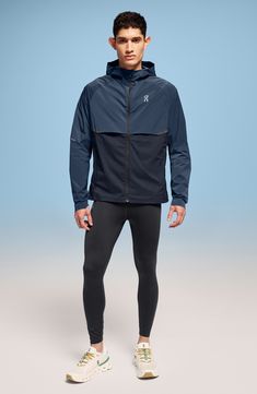 Enjoy the versatility of a lightweight, wind-resistant running jacket designed with a stay-put hood and secure zip pockets. 28 1/2" length (size Medium) Front zip pockets Drawstring hood Partial elastic cuffs with top extension On-seam zip pockets Drawstring hem Packs into pocket Reflective details enhance visibility in low light or at night Lined 87% Recycled polyamide 13% elastane Machine wash, tumble dry Imported Hooded Nylon Running Outerwear, Hooded Nylon Outerwear For Running, Functional Hooded Outerwear For Running, Functional Hooded Running Outerwear, Functional Outerwear With Drawstring Hood For Running, Functional Running Outerwear With Drawstring Hood, Windproof Hooded Outerwear For Running, Fall Hooded Running Outerwear, Navy Functional Windbreaker For Fall