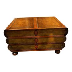 an old wooden box with three drawers