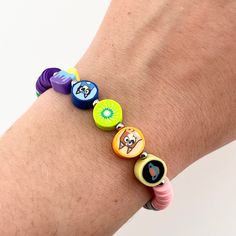 A must-have for any Bluey fan, this comfortable and waterproof bracelet is fun and easy to wear. With polymer beads referencing summer fun, the kiwi rug, and "Sleepytime", you'll have all of your favorite Bluey and Bingo moments with you.  Bracelet is 7 inches long with a 1.5 inch  extension chain. Width: 10 mm (at widest point). Consists of polymer clay beads plus one glass heart bead, all stainless steel findings and spacer beads, and quartz crystal chip beads on the end of the extension chain.  Please message me if you need a bracelet longer than 8.5 inches or shorter than 7! Colorful Adjustable Playful Friendship Bracelets, Playful Adjustable Multicolor Friendship Bracelets, Playful Plastic Jewelry For The Beach, Playful Plastic Beach Jewelry, Blue Playful Friendship Bracelets, Playful Blue Friendship Bracelets, Multicolor Polymer Clay Friendship Bracelets, Multicolor Polymer Clay Friendship Bracelets With Colorful Beads, Fun Multicolor Hypoallergenic Friendship Bracelets