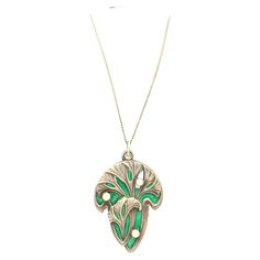 This fine size pendant is decorated with gingko leaves in relief standing out against a green enamelled background. slides open to reveal a mirror. The reverse is marked 900 and impressed with a dragon fly, the Meyle &Mayer's company's signature. Meyle & Mayer was founded in Pforzheim in 1889 and produced strong and expressive Art Nouveau jewellery. The pendant is accompanied by a period fine long silver chain with a length of 39.7 cm. Green Engraved Medallion Necklaces, Green Engraved Medallion Necklace, Engraved Green Medallion Necklace, Green Engraved Necklace For Collectors, Antique Green Locket Necklace, Green Enamel Pendant Necklace, Green Enamel Necklace With Large Pendant, Green Art Nouveau Pendant Necklace, Bijoux Art Nouveau