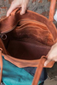 Wonderful tote bag of vintage leather quality , it will be perfect as your essential bag for everyday wear, for students,for work or shopping. This brown shoulder bag is unlined with natural suede interior (one of the photos clearly shows it). Though, You can add lining. Basic bag includes: - two inside pockets -zipper closure -handles -50 cm You can add a shoulder strap. Dimensions: Width top - 40 cm/15.8 inch Width bottom - 32 cm/12.6 inch Height - 35 cm/13.8 inch Depth - 14 cm/5.5 inch Handle Convertible Tote Bag, Convertible Backpack Purse, Laptop Handbag, Leather Makeup Bag, Shoulder Bag Vintage, Brown Backpacks, Laptop Bag For Women, Blue Tote Bag, Women Leather Backpack