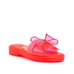 Jessica Simpson-Kesedan Sandal Enjoy a style that is a blast from the past! The Kesedan sandal from Jessica Simpson radiates early 2000s vibes thanks to the playful jelly material. Featuring a slide silhouette, rhinestone details, and a block heel, this bold pair adds a playful pop to any look. Summer Slip-on Slides With Translucent Outsole, Spring Clear Jelly Sandals With Translucent Outsole, Clear Synthetic Jelly Sandals For Spring, Trendy Sandals With Translucent Outsole, Spring Jelly Sandals With Translucent Outsole, Spring Clear Flat Jelly Sandals, Trendy Clear Synthetic Jelly Sandals, Summer Slide Sandals Made Of Plastic, Summer Translucent Outsole Open Toe Jelly Sandals