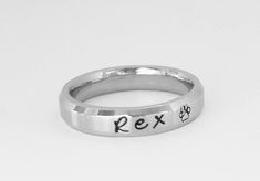 This gorgeous ring is 4 mm wide in solid stainless steel. It has a brushed finish with shiny rim and is a Comfort Fit ring, goes on like silk and will be the most comfortable ring you ever wear. I can fit up to 25 characters on this ring. Names, dates, quotes, scripture or roman numerals. This ring is dainty, and with it's flat surface the names really stand out. I sell this ring also on my page as a set of 2, this same style comes in 6 & 8 mm. Stainless steel never tarnishes, changes color, Adjustable Hand Stamped Initial Ring For Promise, Adjustable Hand Stamped Everyday Rings, Adjustable Hand Stamped Rings For Everyday, Everyday Hand Stamped Stackable Rings, Hand Stamped Stackable Rings For Promise, Customizable Stackable Promise Rings, Adjustable Hand Stamped Engraved Ring, Adjustable Stainless Steel Engraved Promise Ring, Hypoallergenic Promise Stackable Round Rings