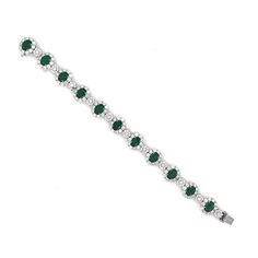 A beautiful emerald and diamond platinum bracelet. Stunning oval cut green emeralds 11.82 ct in total. Accented by white natural diamonds 10.77 ct in total. Diamonds are all natural in G-H Color Clarity VS. Platinum 950. This a stunning, timeless, classic bracelet perfect for all special occasions. Length: 18.9 cm Width. 1.2 cm Weight: 48.6 g [shortcode] [video] [/video] [/shortcode]