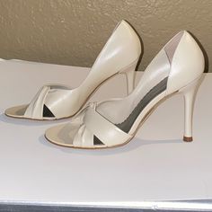 New Ivory Color Leather Heels. Twisted Front Design Peep Toe. Tiny Spec On Side Heel See Pics. Chic Fitted Wedding Shoes With Round Toe, Cream Heels With 4-inch Heel, Elegant Cream Sandals With Pointed Toe, Feminine Cream Heels With Round Toe, Elegant Cream Pointed Toe Sandals, Classic Spring Wedding Shoes With Almond Toe, Classic Wedding Shoes With Almond Toe For Spring, Cream Round Toe Heels For Evening, Beige 4-inch Heel Wedding Shoes For Summer