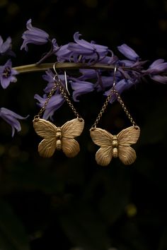 A beautiful symbol of metamorphosis and transformation. These wonderfully detailed butterfly earrings (or moth if you prefer) have a realistic look in an antique style. Crafted from solid raw (not plated) brass with solid raw brass chain and solid sterling silver ear hooks. These earrings are a good size, but very light weight. I added a patina to enhance the antique feel and highlight the texture. Be sure to check out my butterfly pin to match! length: 2 1/2 inches long including the ear wire w Bohemian Silver Butterfly Earrings, Vintage Brass Hypoallergenic Earrings, Vintage Hypoallergenic Brass Earrings, Hypoallergenic Vintage Brass Earrings, Bohemian Butterfly Nickel-free Jewelry, Bohemian Butterfly Earrings For Pierced Ears, Bohemian Butterfly Jewelry With Pierced Design, Gold Butterfly-shaped Brass Jewelry, Gold Butterfly Shaped Brass Jewelry